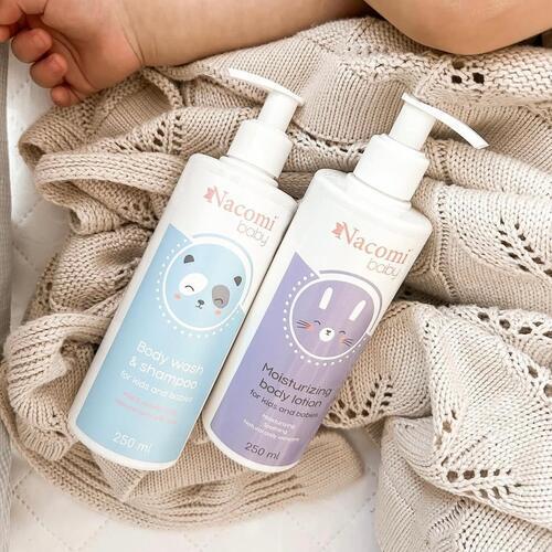 Two Naomi Baby skincare products on a textured fabric background
