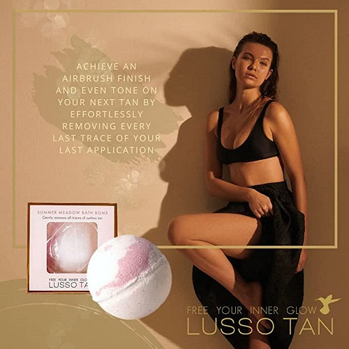 Woman posing with a Lusso Tan Removing Bath Bomb on a beige background